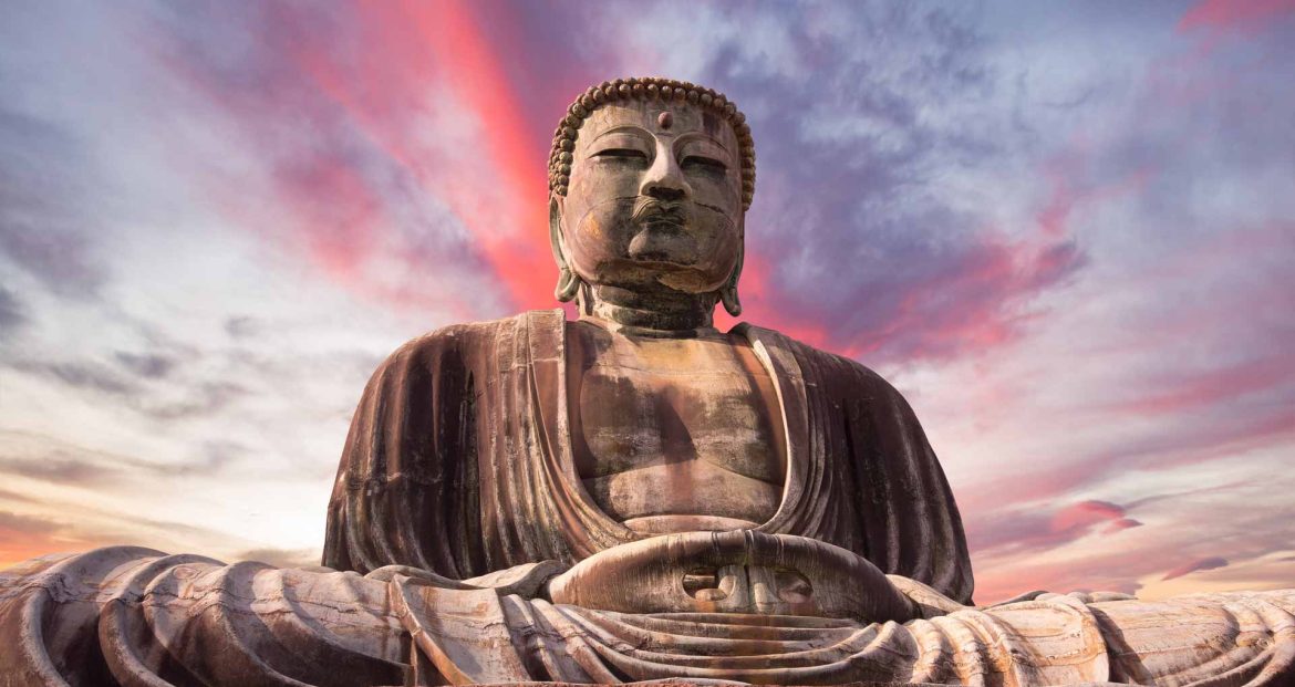 giant-buddha-statue-under-at-sunset-65WYC4Z