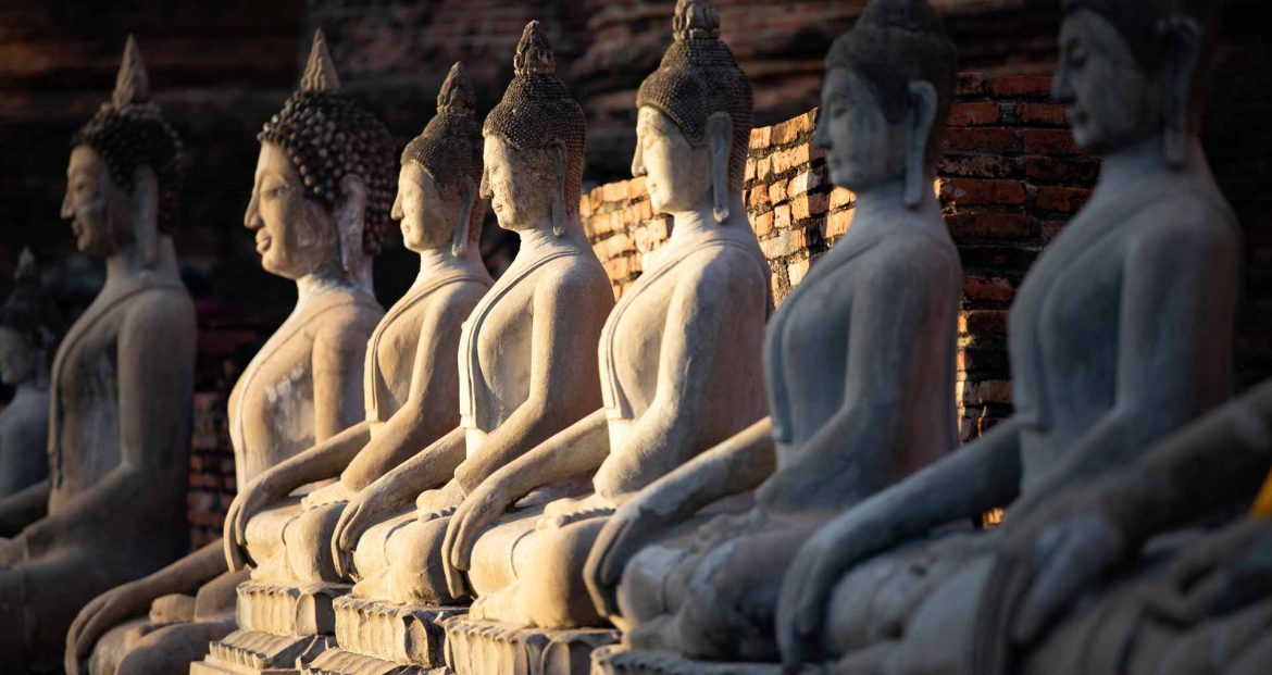 sitting-buddha-statues-at-wat-yai-chai-mongkhon-GTD695P