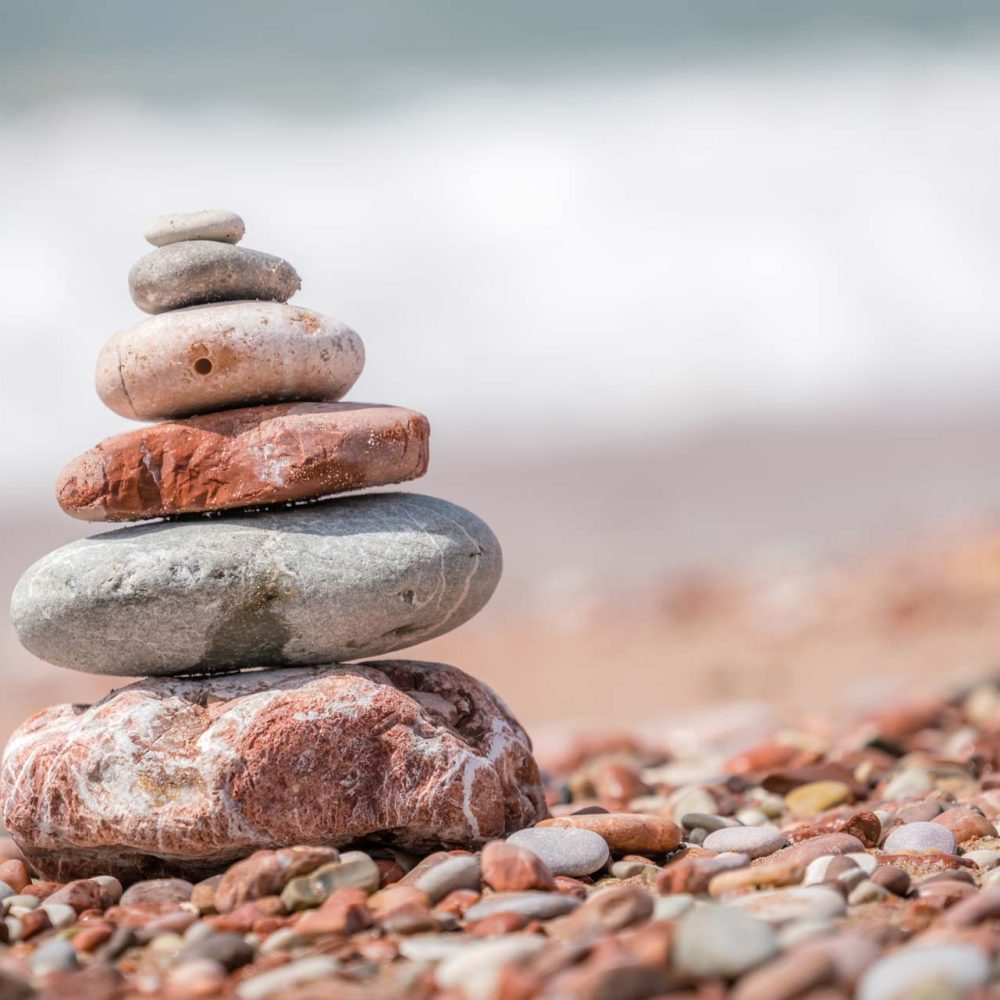 zen-balanced-small-pile-of-stacked-stones-GR5MQKW