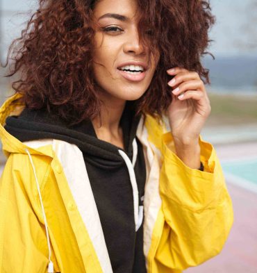 amazing-african-curly-young-woman-wearing-yellow-PCUMRSX-unsplash