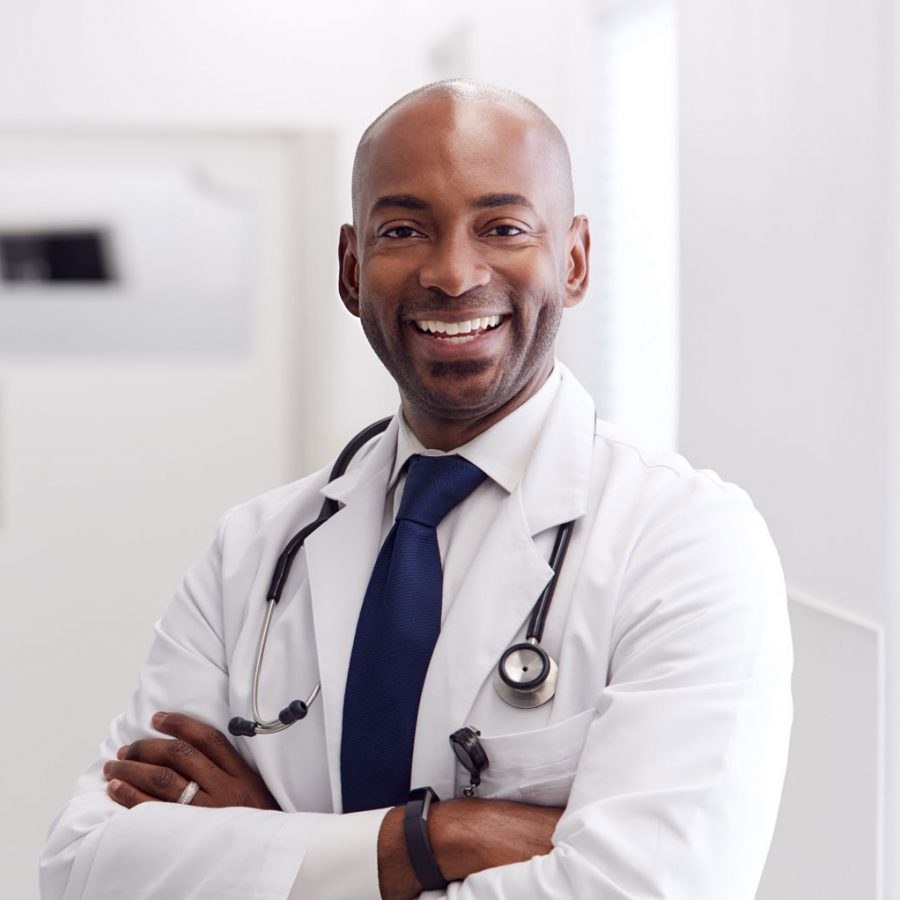 portrait-of-mature-male-doctor-wearing-white-coat-H49URGD-1