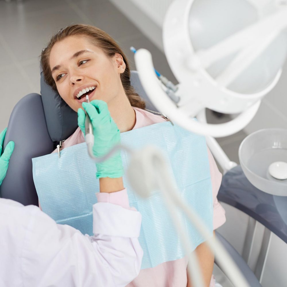 young-woman-at-dental-exam-3XD85GH