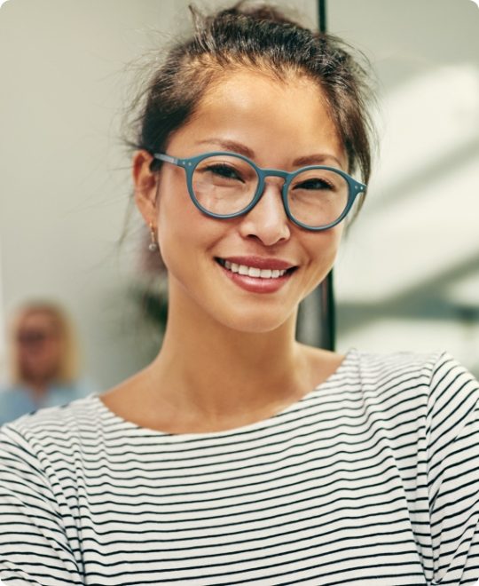 young-asian-businesswoman-smiling-confidently-in-a-4H6MSAK-small