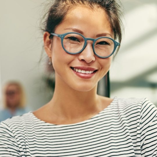 young-asian-businesswoman-smiling-confidently-in-a-4H6MSAK-small
