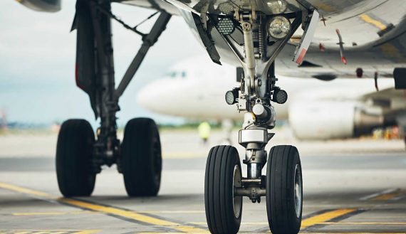 Chassis of the airplane. Plane taxiing from the runway to the gate.