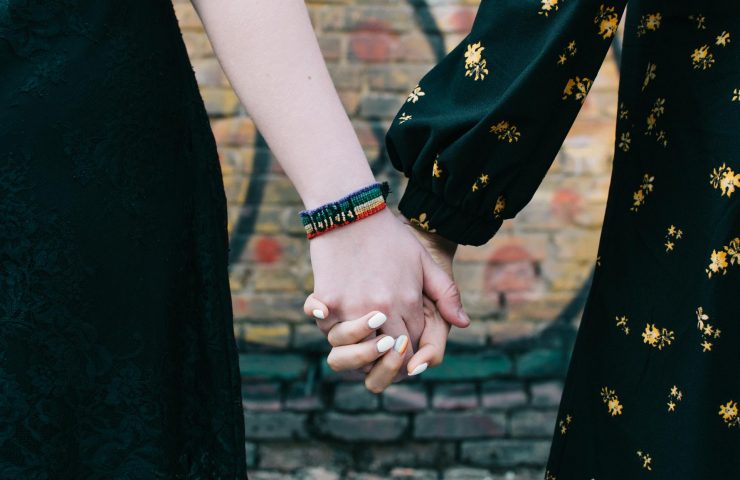 loseup-of-two-female-lgbt-gay-couple-holding-hands-SUH5M4E