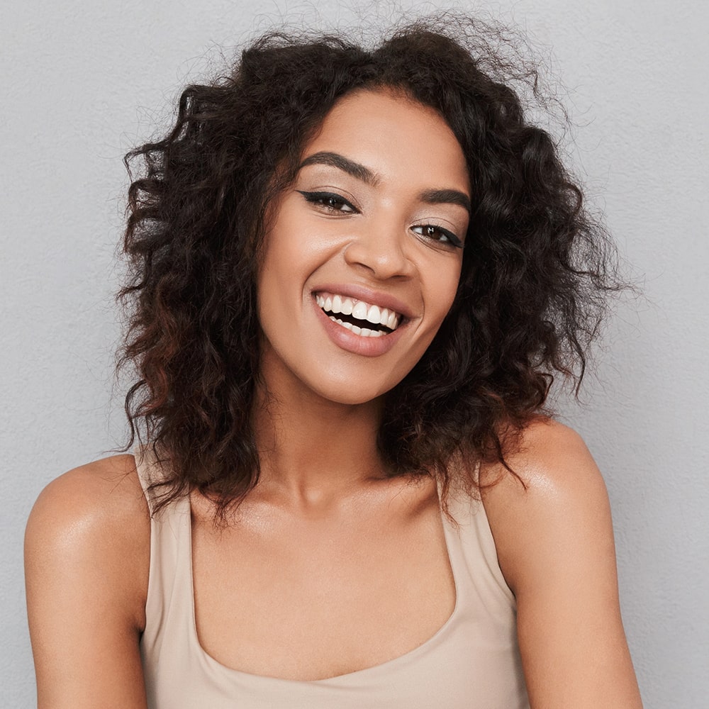 portrait-of-a-happy-young-african-woman-XCUHNJQ